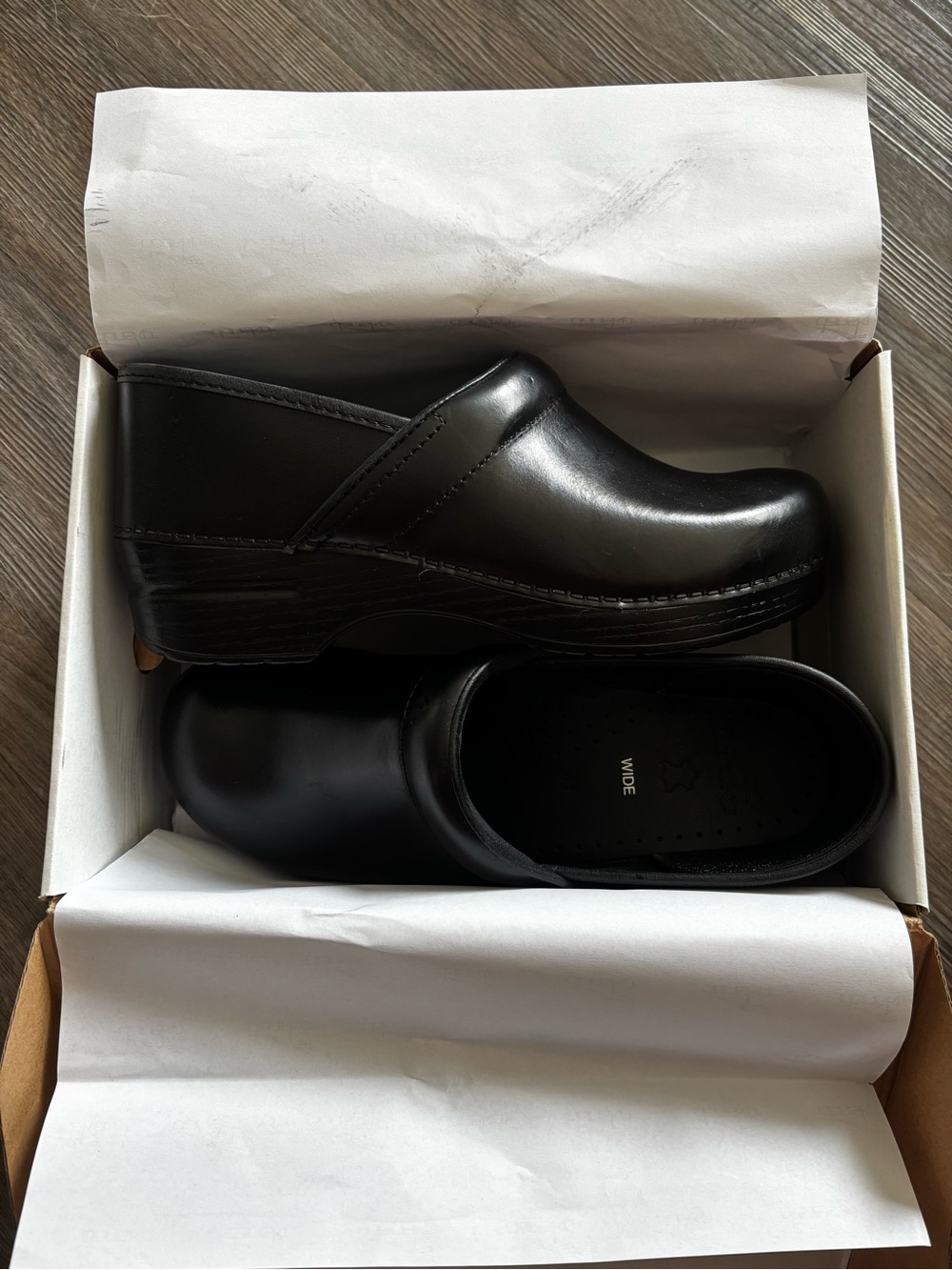 Dansko black leather clogs